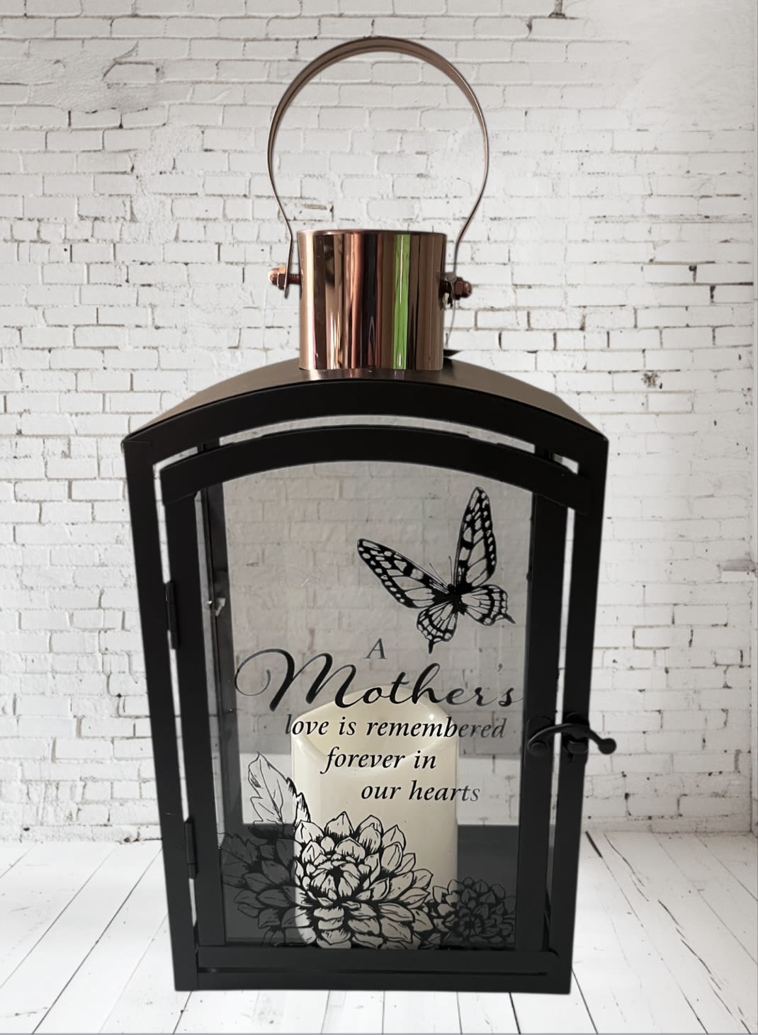 Black lantern with a candle and a Mother's Day memorial message
