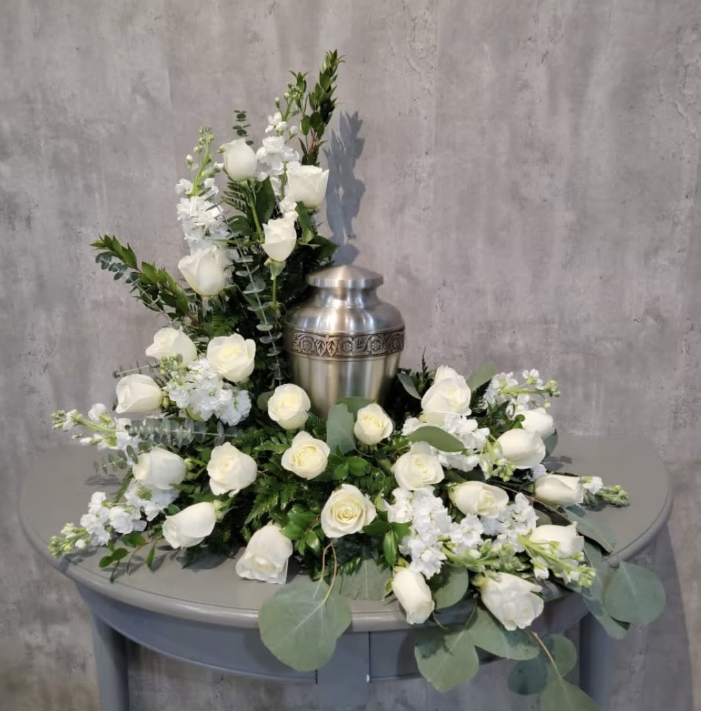 Graceful Love - This urn arrangement has roses, stock, silver dollar eucalyptus, spiral eucalyptus and leather leaf. Urn not included