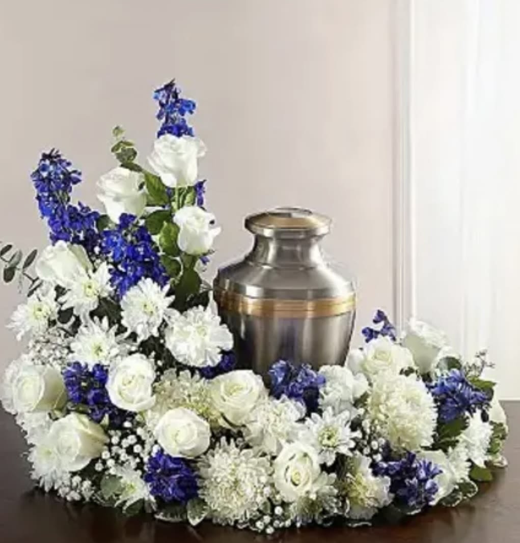 Blue Sky’s  - This arrangement has Delphinium, roses, baby’s breath, carnations, Mums and greenery. 