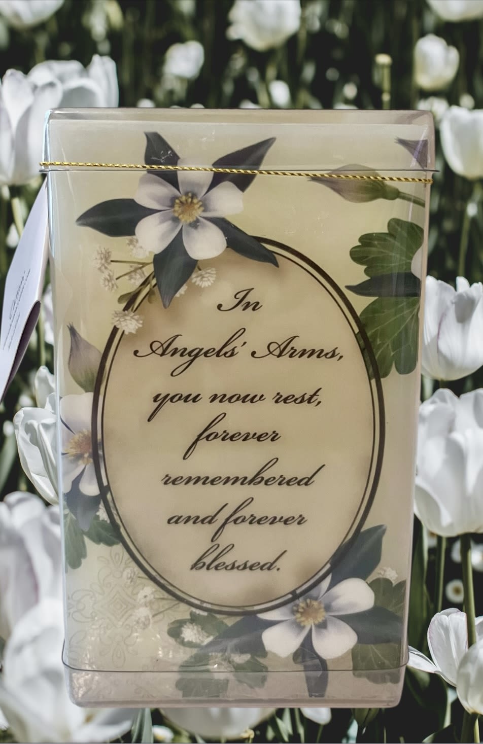 Sympathy card with white flowers and a memorial message