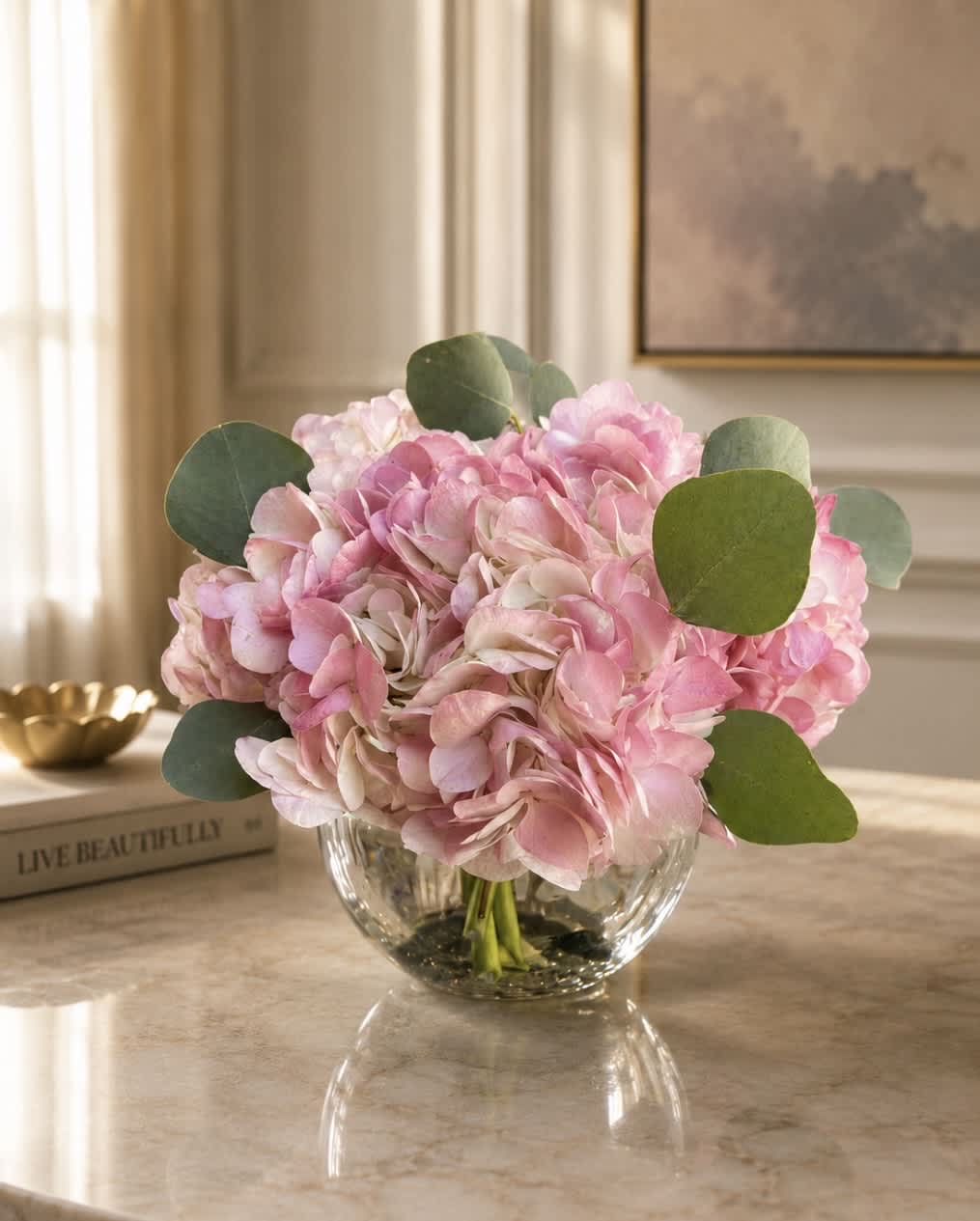 Pink hydrangea bouquet in a clear glass vase
