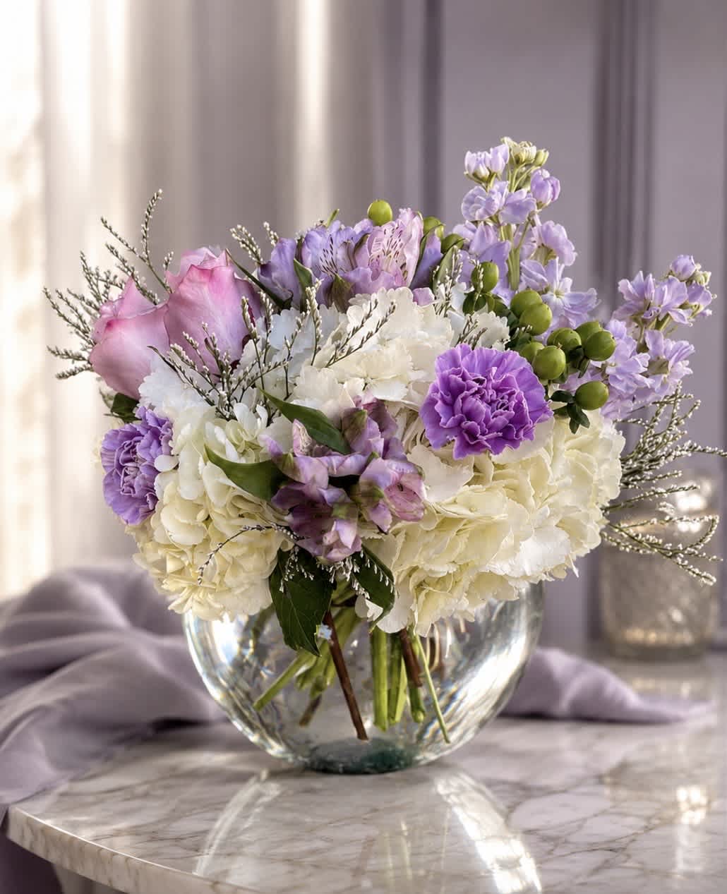 Lavender and white bouquet in a clear glass vase