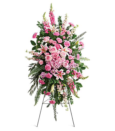 Tall pink floral standing spray on an easel
