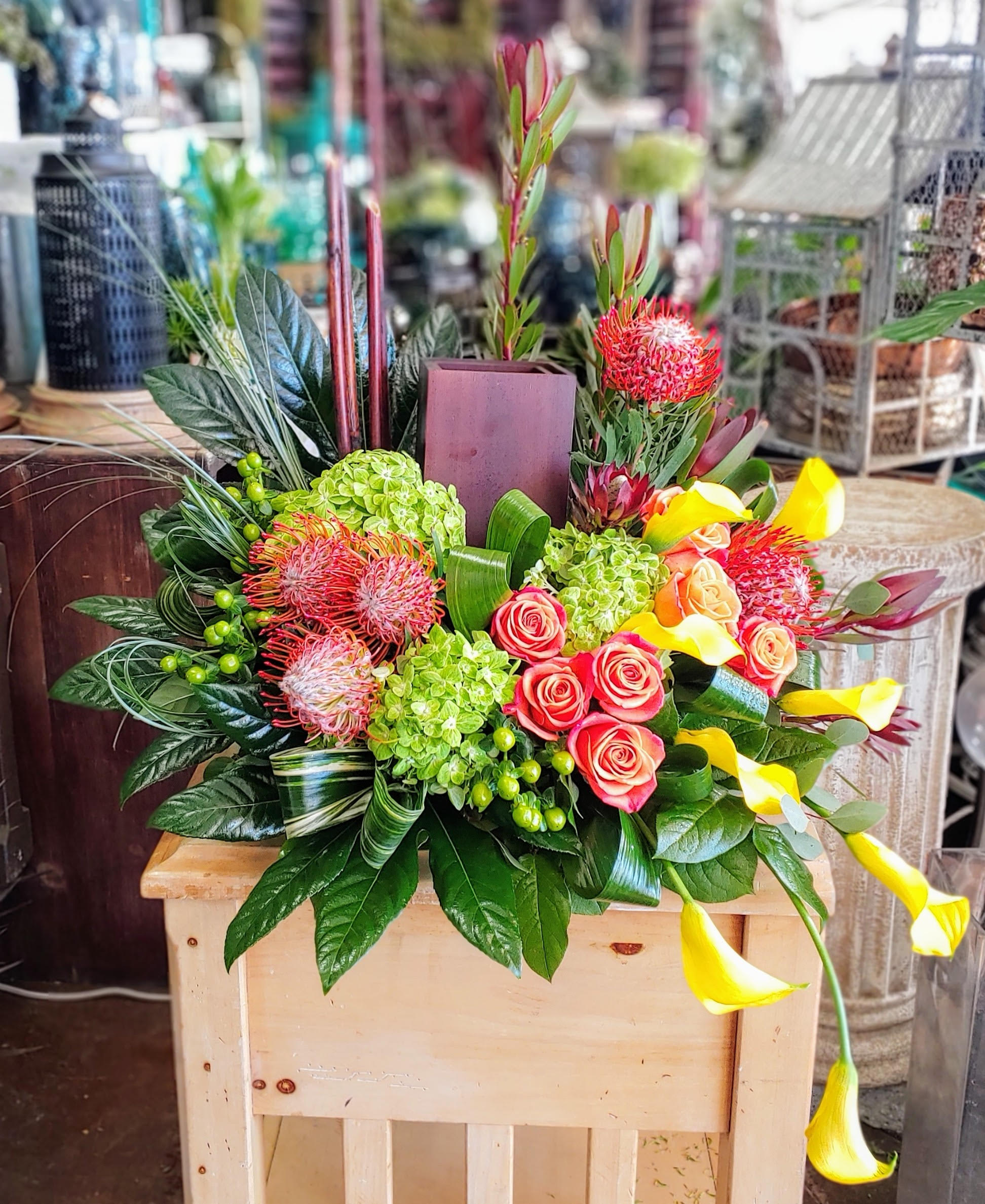 Mixed bouquet with pink roses, green hydrangeas, and yellow calla lilies
