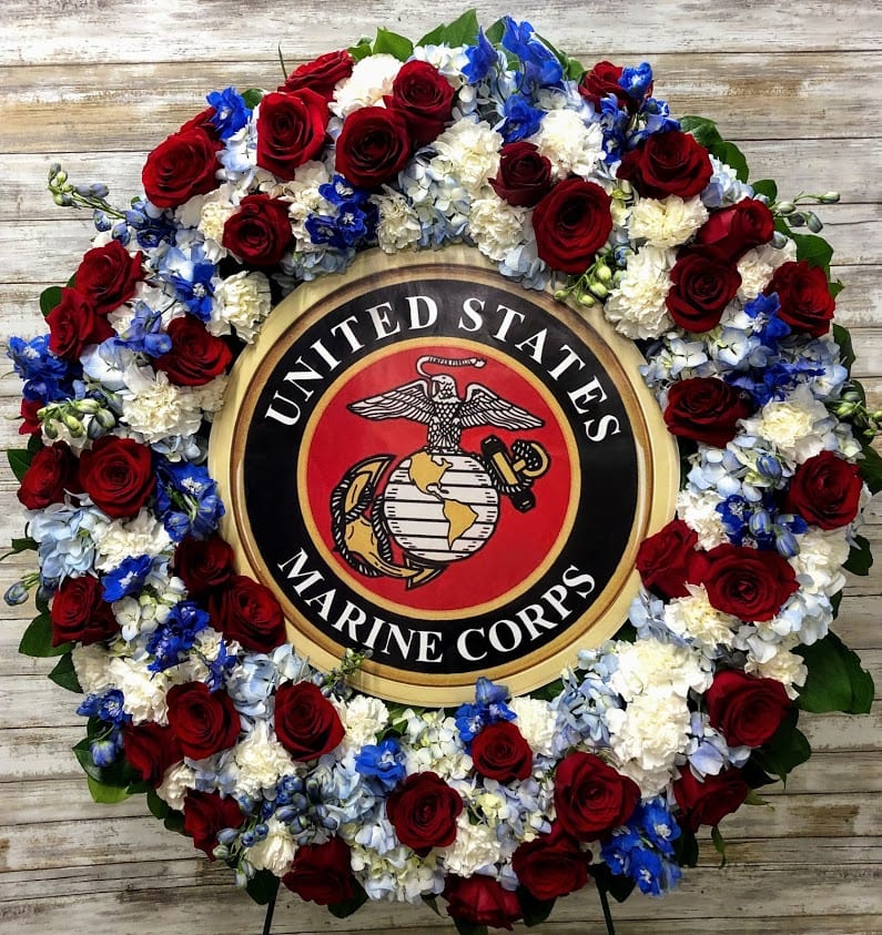 Floral wreath around a United States Marine Corps emblem