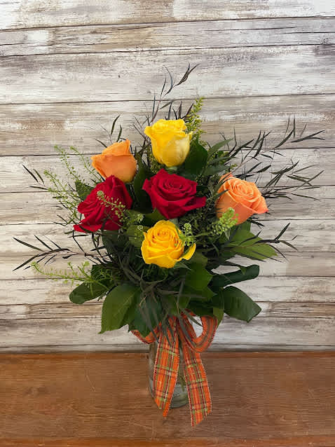 Fall Rose Vase - 6 Premium Fall Roses arranged in a glass vase with accents of solidago and greenery. All tied up with a pretty bow. Approx. 20" Tall 