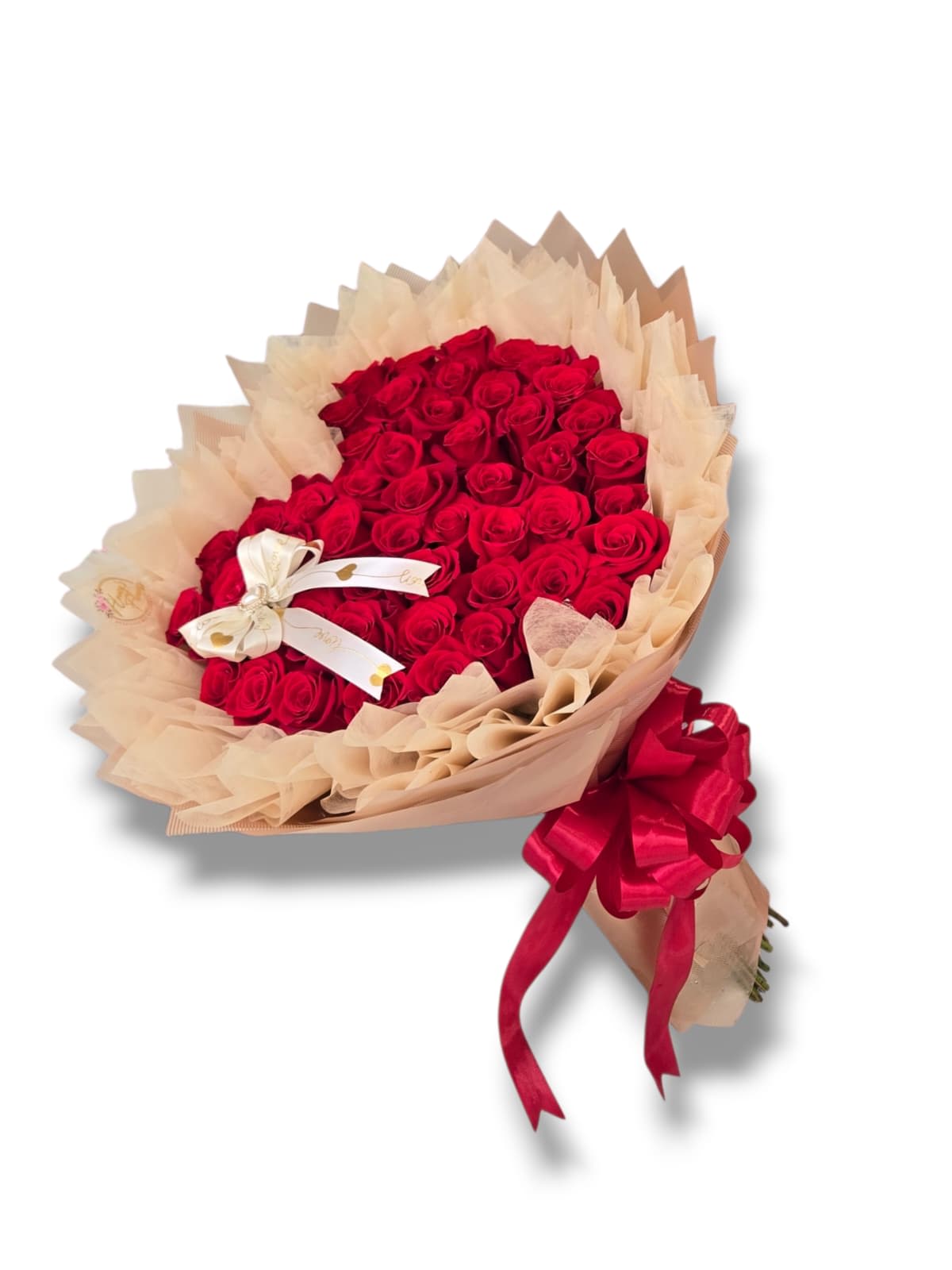Bouquet of red roses wrapped in beige paper with a red ribbon