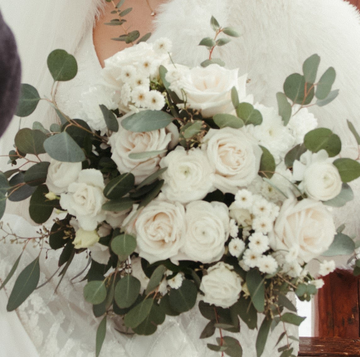 White rose bouquet with eucalyptus and small white filler flowers