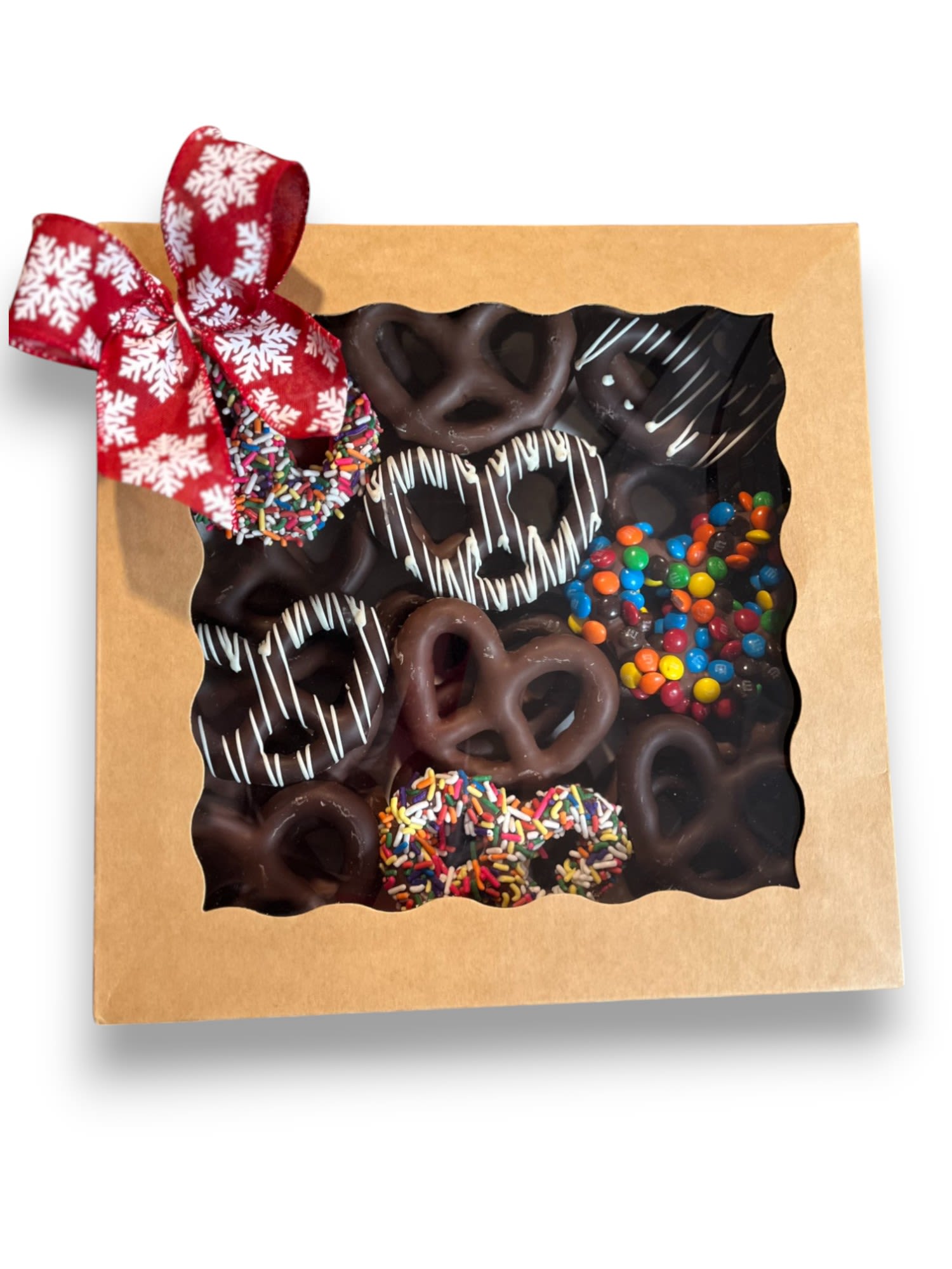 Box of chocolate-covered pretzels with a red ribbon bow