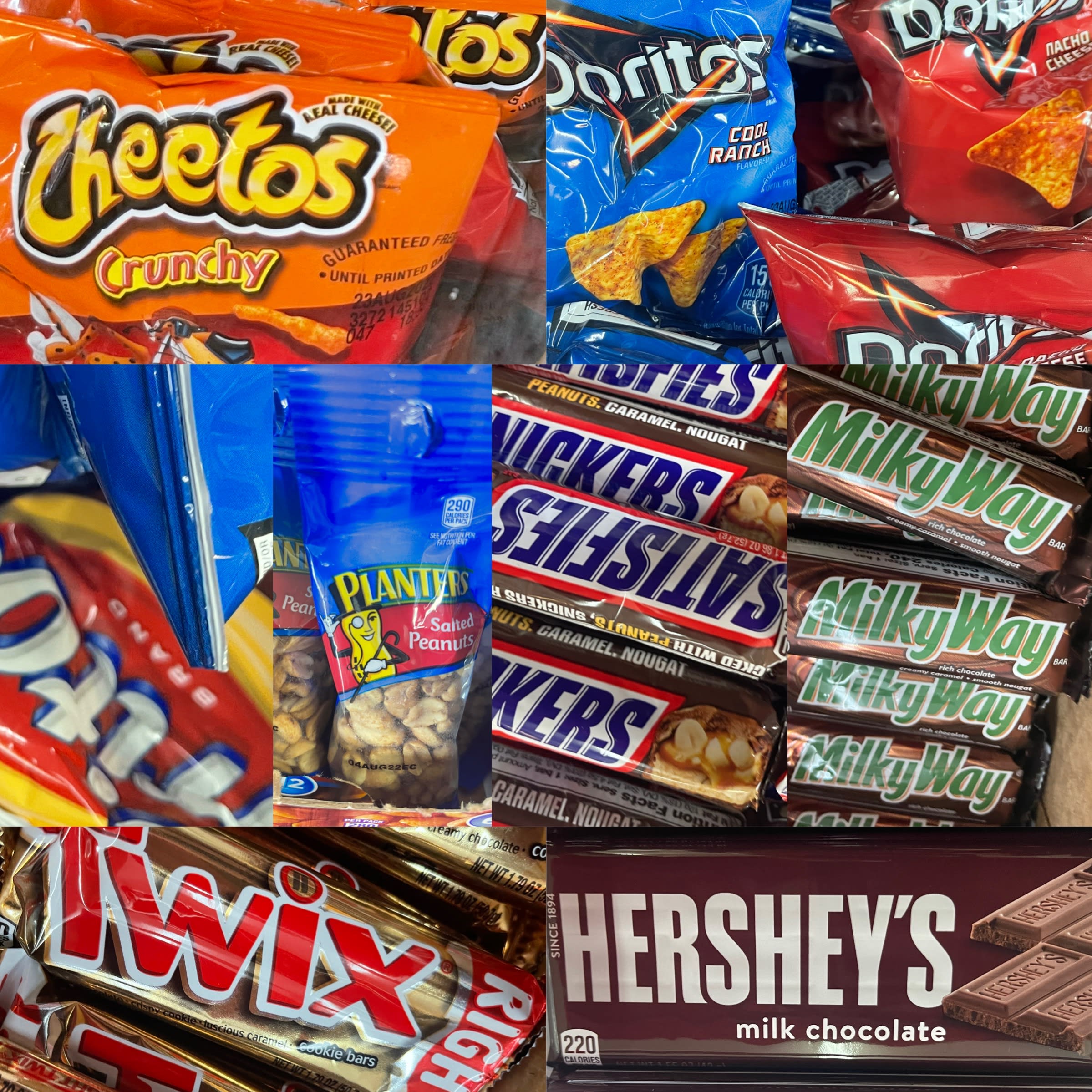 Assorted candy bars and snack bags stacked together