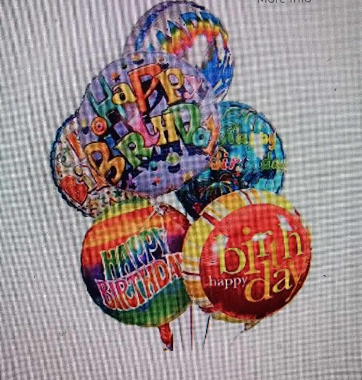 Cluster of colorful birthday balloons with printed messages