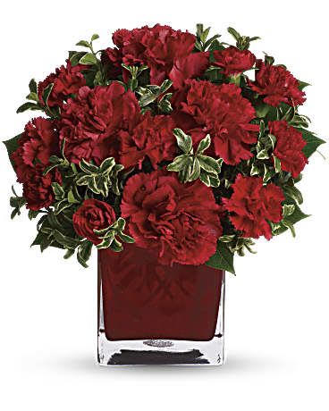 Precious Love Bouquet  - Simply speaking, red means romance. Send this bouquet of vibrant red carnations to your sweetheart and you'll convey passion, energy and desire. Remember also that you're sending not one gift but two: gorgeous flowers and a colorful cube vase. A mix of red carnations and red miniature carnations is delivered in a red glass cube vase. *Arrangement is small to medium size*