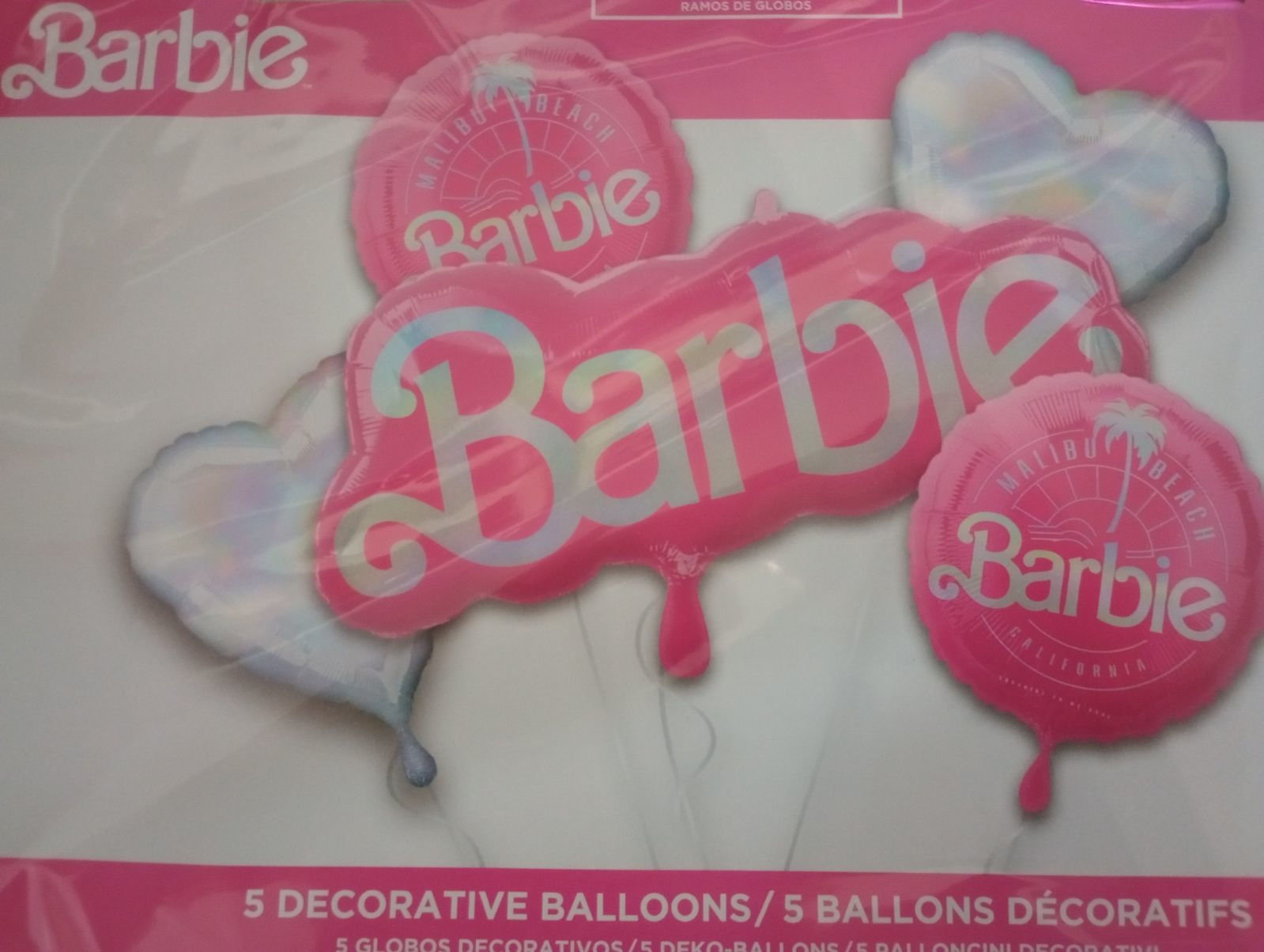 Barbie-themed decorative balloons in pink and white