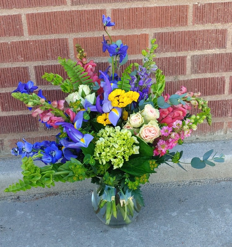Colorful mixed bouquet in a clear glass vase