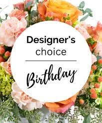 Birthday floral arrangement with pink and orange blooms