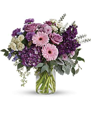 Pink and purple mixed bouquet in a clear glass vase