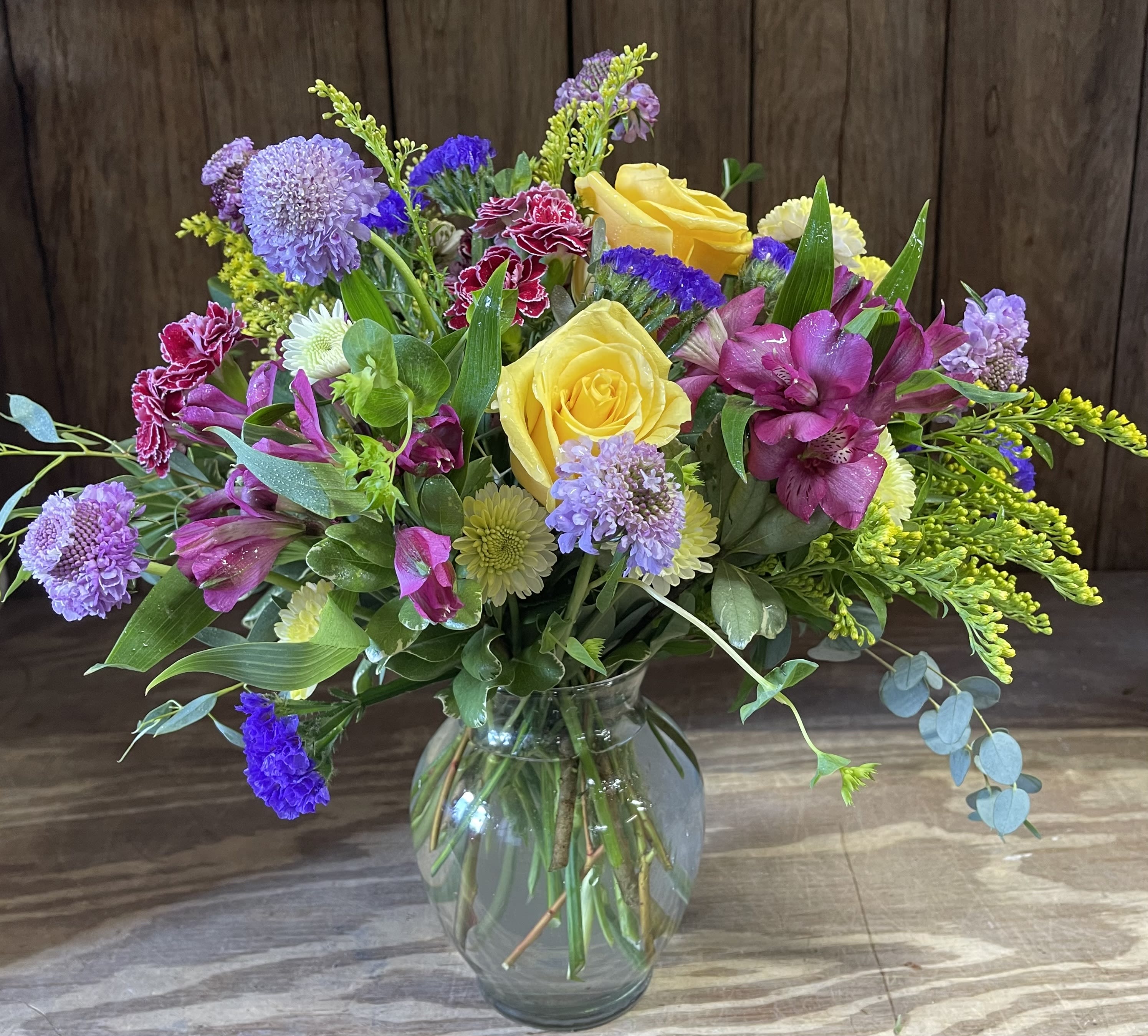 Beautiful Day - Bright and Cheerful and flowers all around! What a lovely display of florals in many colors.