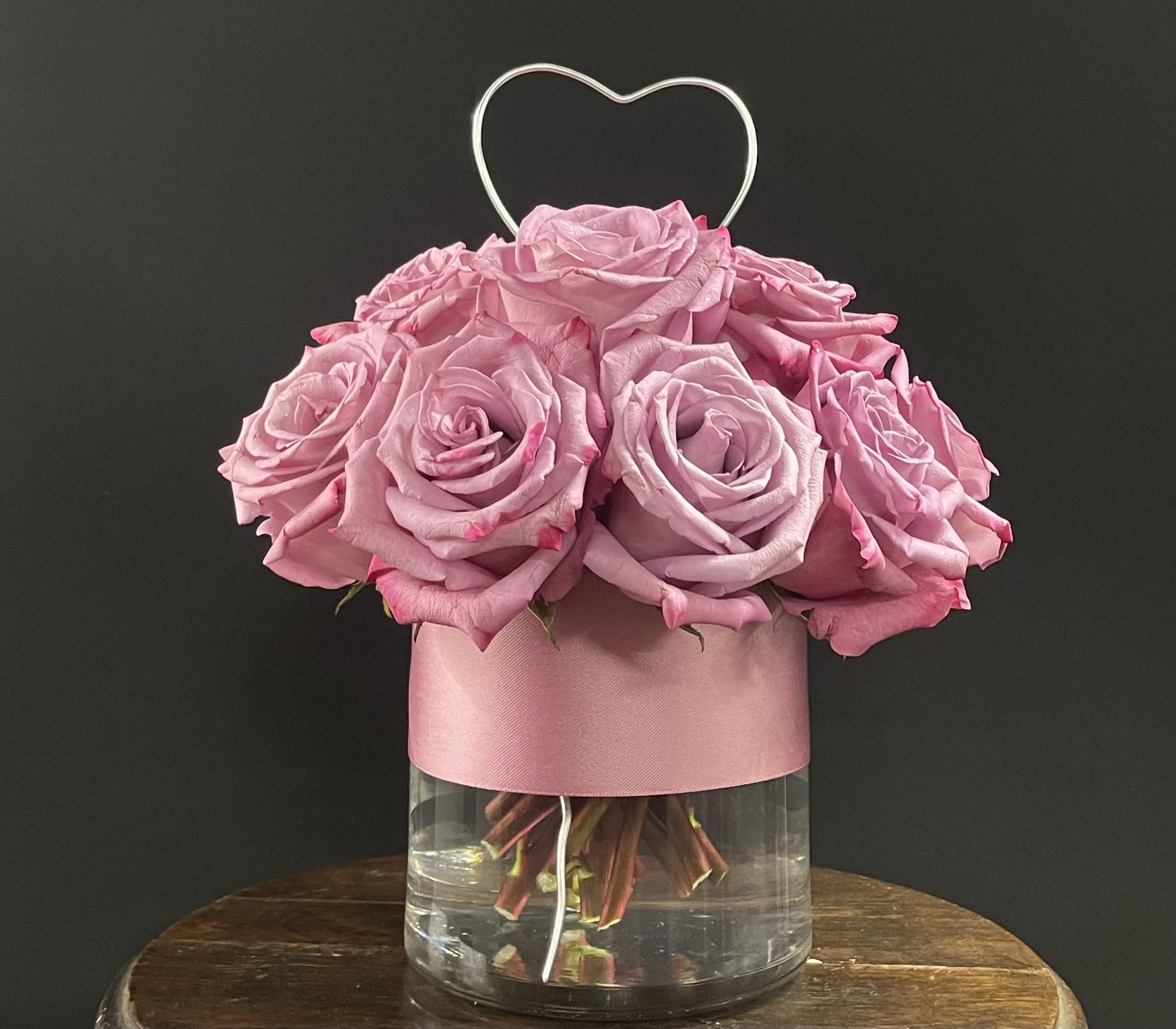 Enchanted Love Compact Roses YOU CHOOSE COLOR - This beautiful rose bouquet is guaranteed to brighten someone's day. Enchanted Love is perfect for someone's birthday, anniversary, just because, or for anyone that needs cheering up.  Please indicate the color of rose you would like in "Special Instructions" or give us a call. (317)398-2577  Arrangement Details:  13 Roses APPROXIMATE DIMENSIONS:  10"D X 10"H