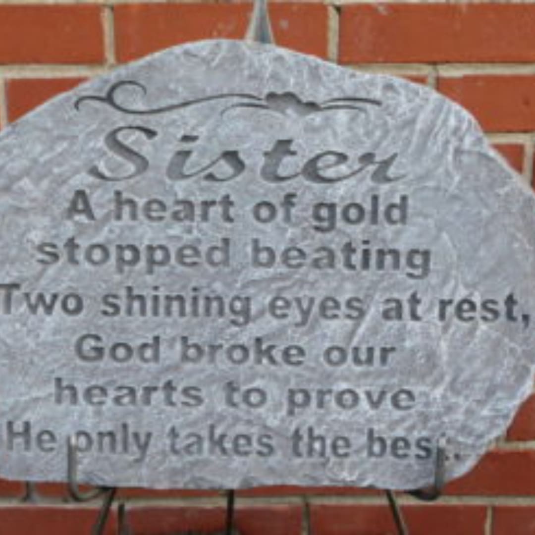 Stone memorial plaque with the word Sister and a poem engraved on it