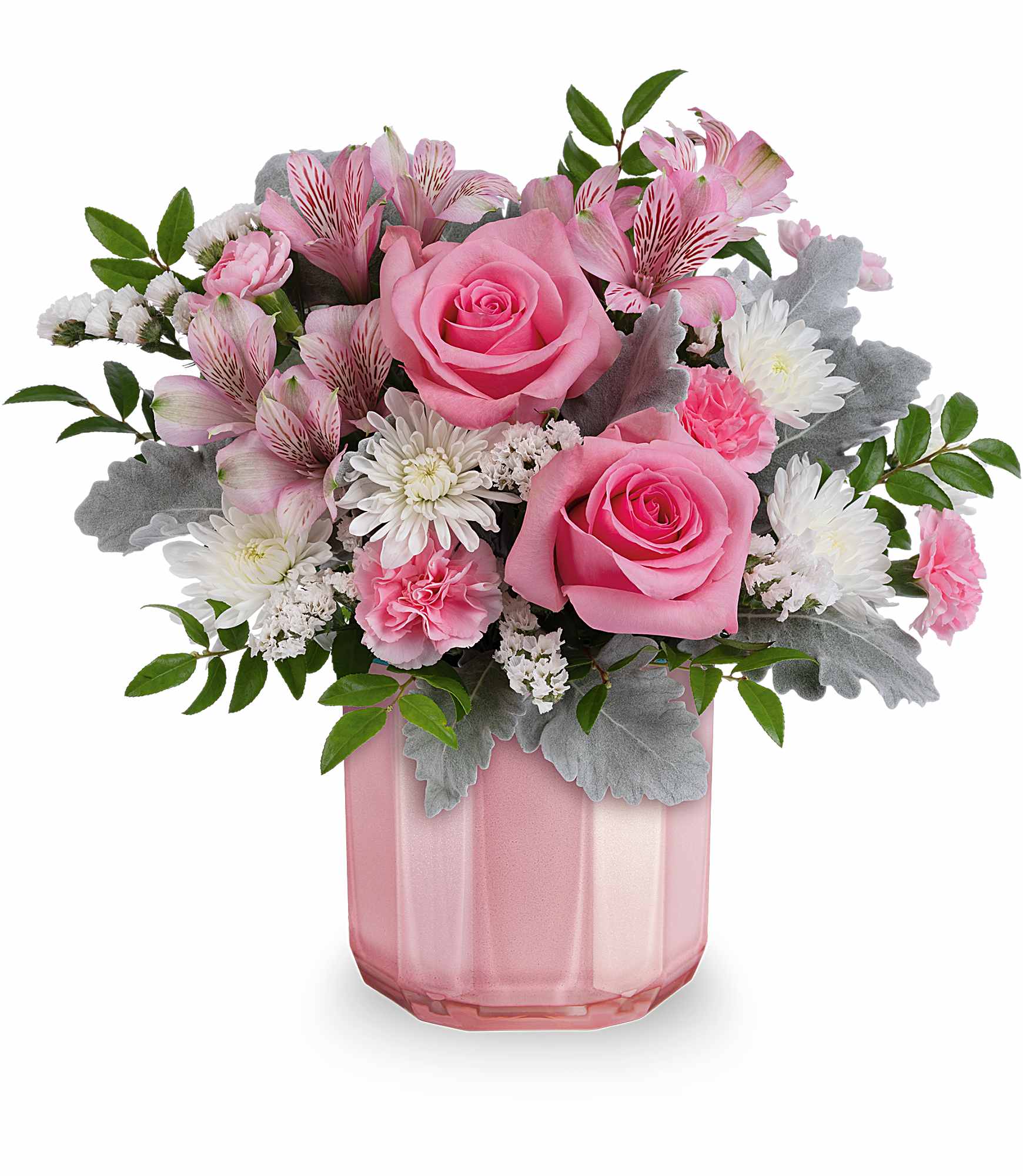 Pink roses and mixed blooms arranged in a pink glass vase