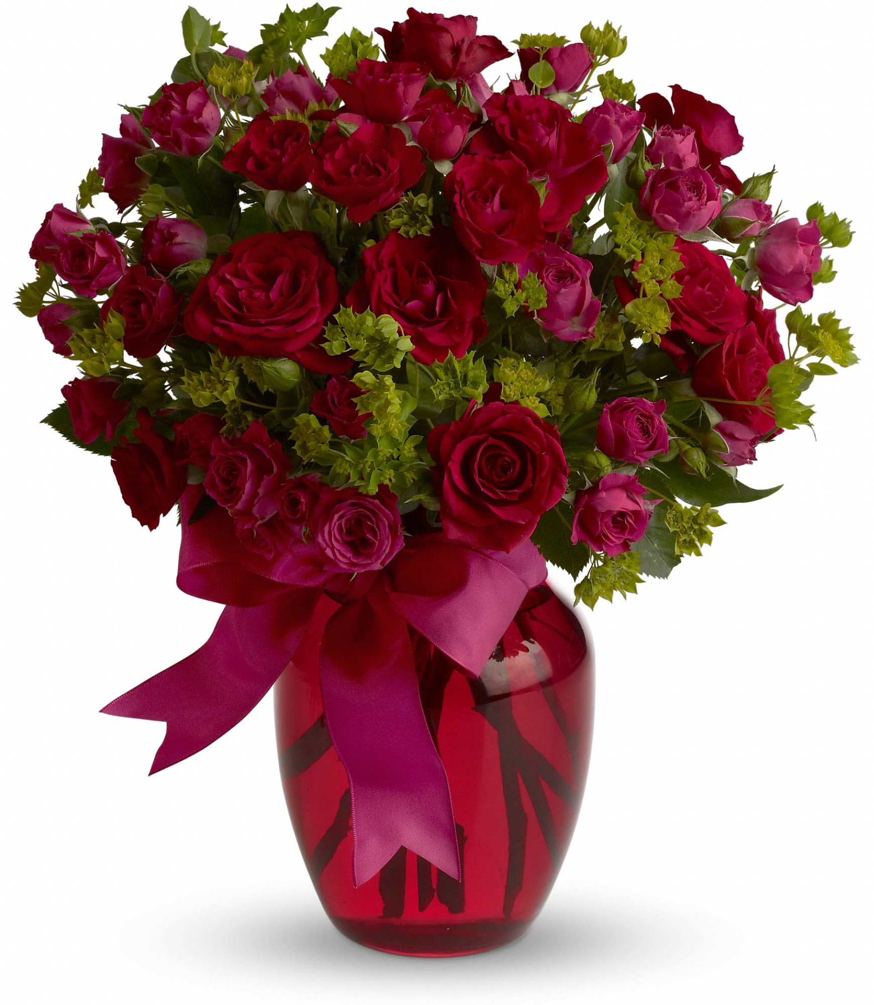 Bouquet of red and pink roses in a red glass vase with a ribbon