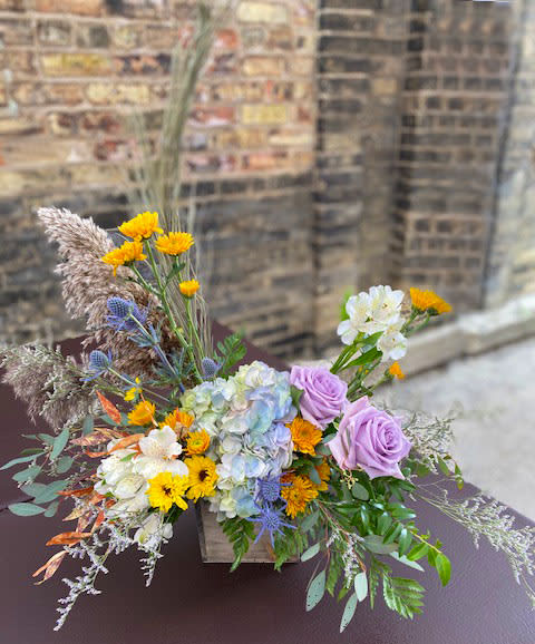 Rustic Charm - This design is gorgeous! Perfect for fall with hydrangea, roses, pomps, grasses and so much more. A wonderful display for any occasion.  We are proud to deliver our flower creations to the Kenosha, Somers and Pleasant Prairie area. With over 55 years of combined flower design experience in Kenosha, Wisconsin, A Summer's Garden Florist and Gifts is the perfect choice for the freshest flowers, most creative design and exceptional customer service.