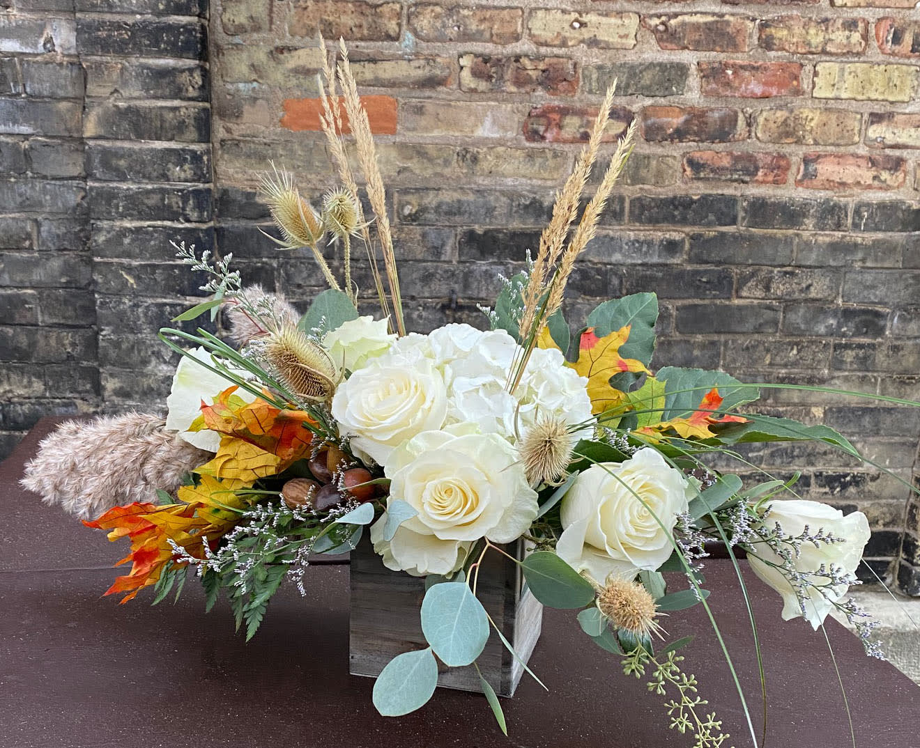 Fall Chic - An elegant take on fall. Roses, hydrangea and various foliages and fall trims make up this amazing arrangement.  We are proud to deliver our flower creations to the Kenosha, Somers and Pleasant Prairie area. With over 55 years of combined flower design experience in Kenosha, Wisconsin, A Summer's Garden Florist and Gifts is the perfect choice for the freshest flowers, most creative design and exceptional customer service.