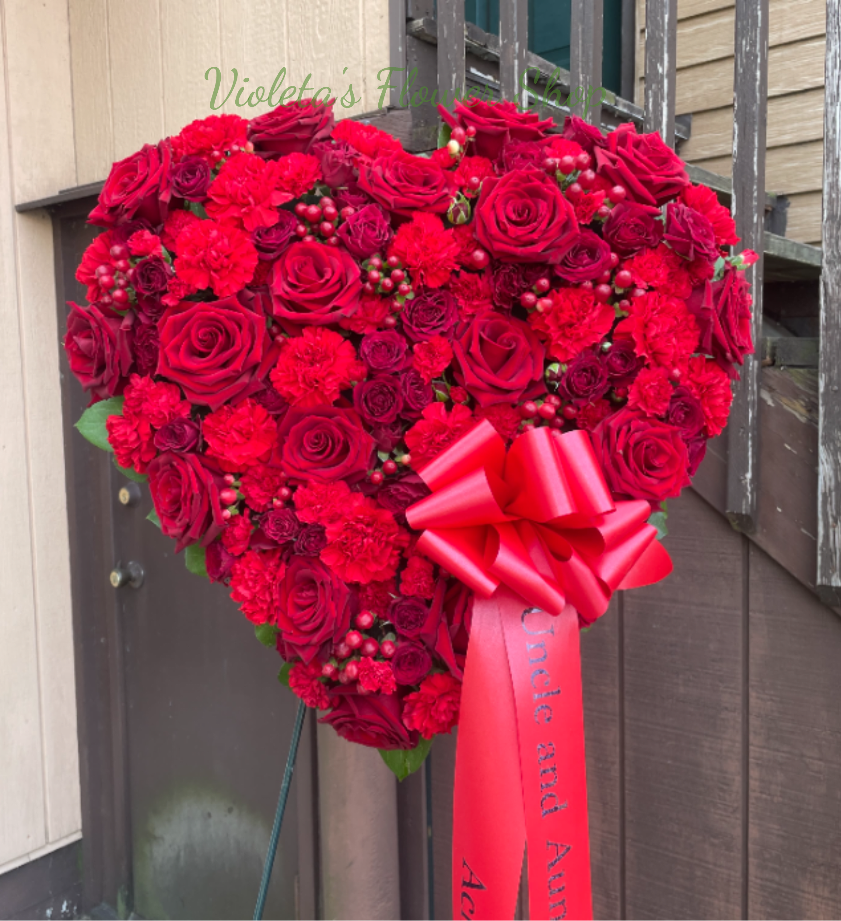 With All My Heart - Solid heart of mixed red flowers- great to be display at the service. Approximately size 18"