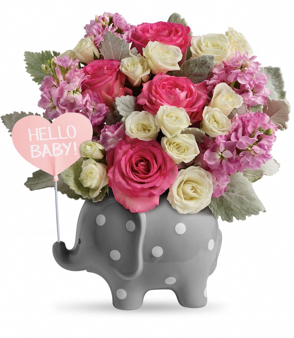 Pink and white rose bouquet in a gray elephant vase with a "Hello Baby!" sign