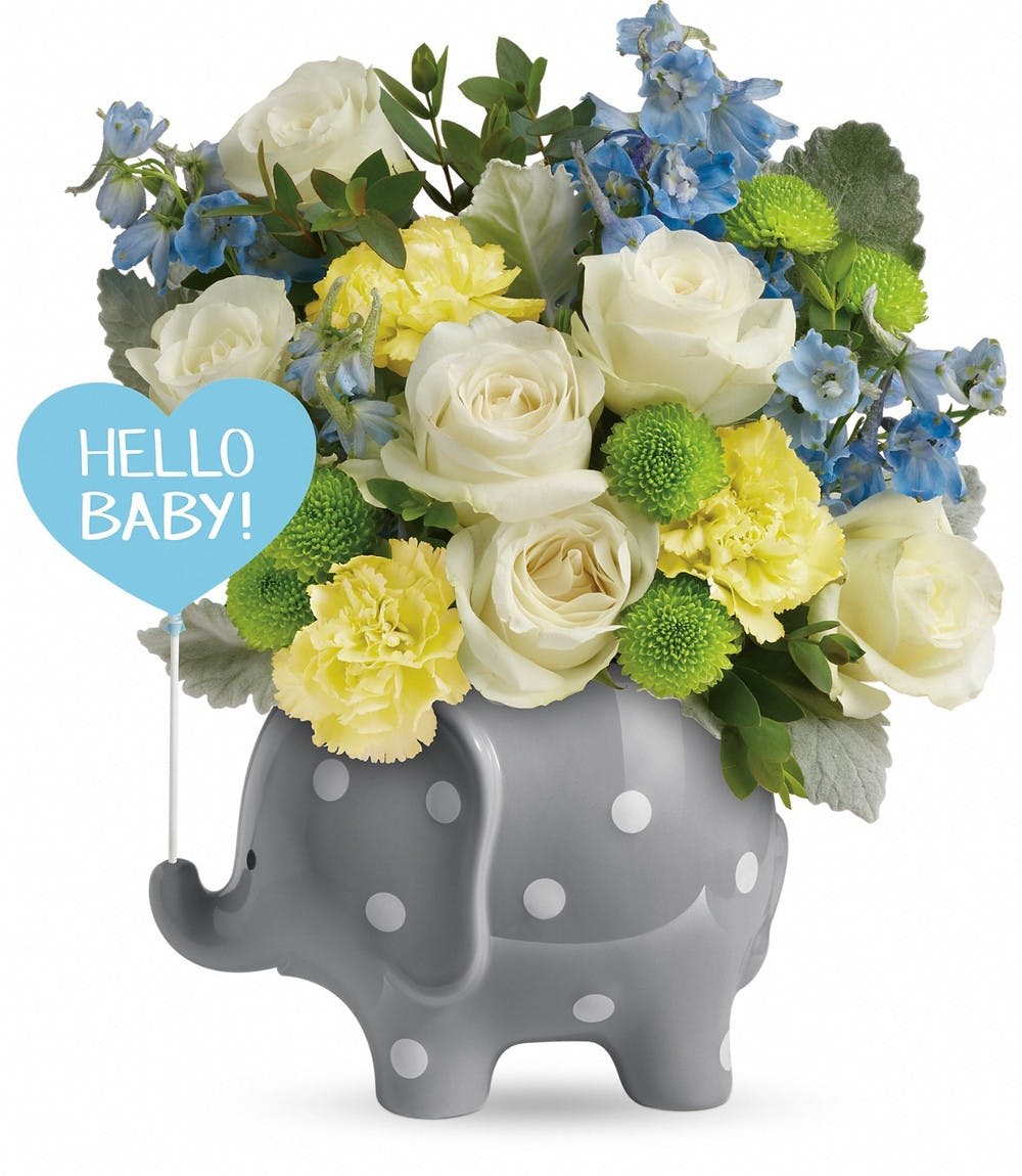 Bouquet in a gray polka-dot elephant container with a "Hello Baby!" sign