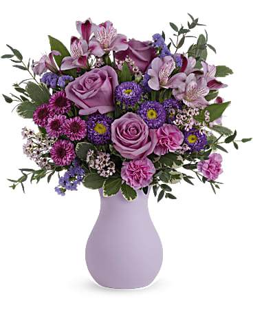 Pink and purple mixed bouquet in a lavender vase