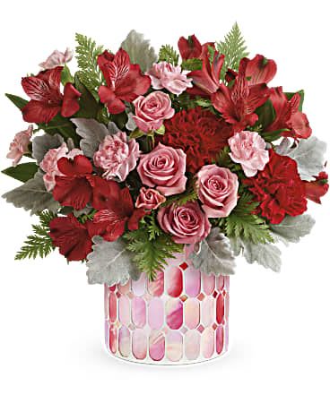 Precious in Pink - Brimming with stylish blooms, this unique mosaic vase of swirling stained glass is a glorious gift they'll always treasure. This pretty arrangement features pink spray roses, pink alstroemeria, miniature hot pink carnations, seeded eucalyptus, parvifolia eucalyptus, leatherleaf fern and lemon leaf. Delivered in the Precious in Pink cylinder. Orientation: All-Around 