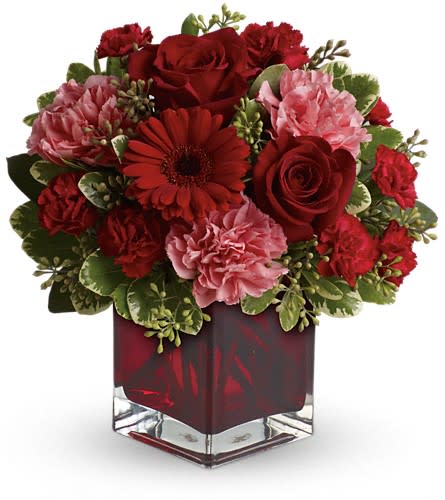 Together Forever by Teleflora - Hoping to be together forever? Whether you'd like to send a message of love to a favorite beau best friend or family member this charming crimson-hued bouquet - delivered in a special Teleflora cube vase - will be a lovely sentiment of your affection. A mix of roses carnations and more in shades of red and pink accented with greenery is delivered in a red glass Teleflora cube vase. Approximately 11" W x 10" H Orientation: One-Sided As Shown : T05N430ADeluxe : T05N430BPremium : T05N430C