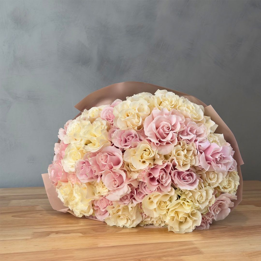 Blush &amp; White Harmony - A luxurious bouquet of soft pink and white roses wrapped in elegant blush paper. Romantic, timeless, and full of charm, this abundant rose bouquet is perfect for celebrating love, special occasions, or simply making someone feel cherished. Custom greeting card included.