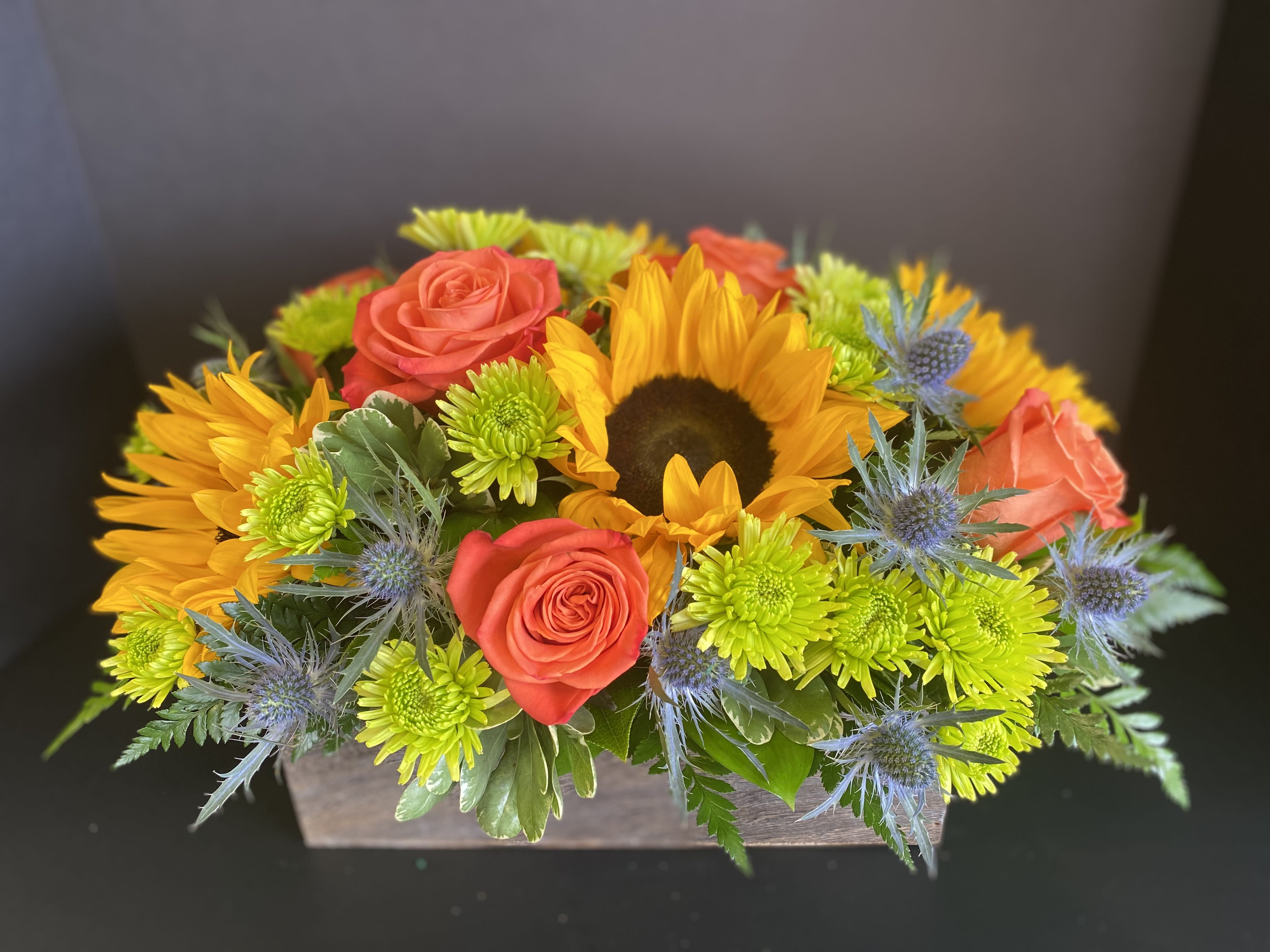 Sunflower Delight - A Bright and Cheerful Low and Lush Centerpiece in a Wooden Box. 