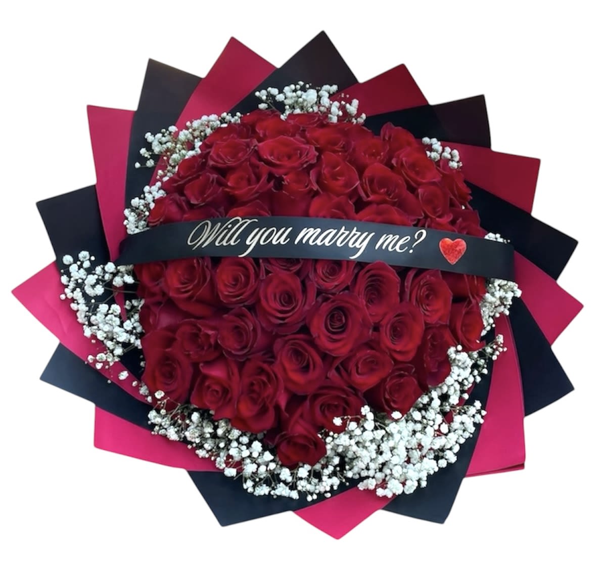Bouquet of red roses with baby's breath and a "Will you marry me?" ribbon