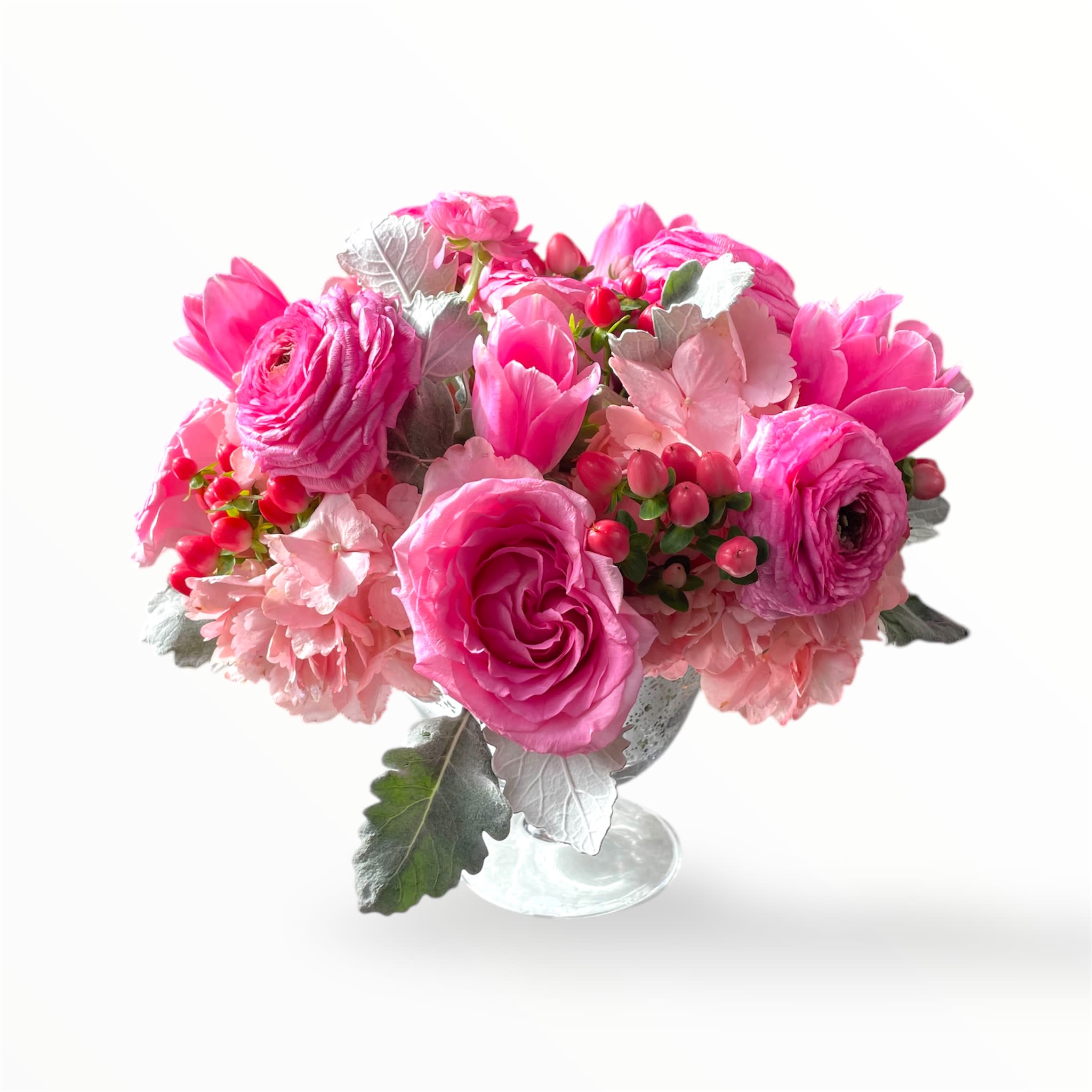 Pink floral arrangement in a clear glass vase