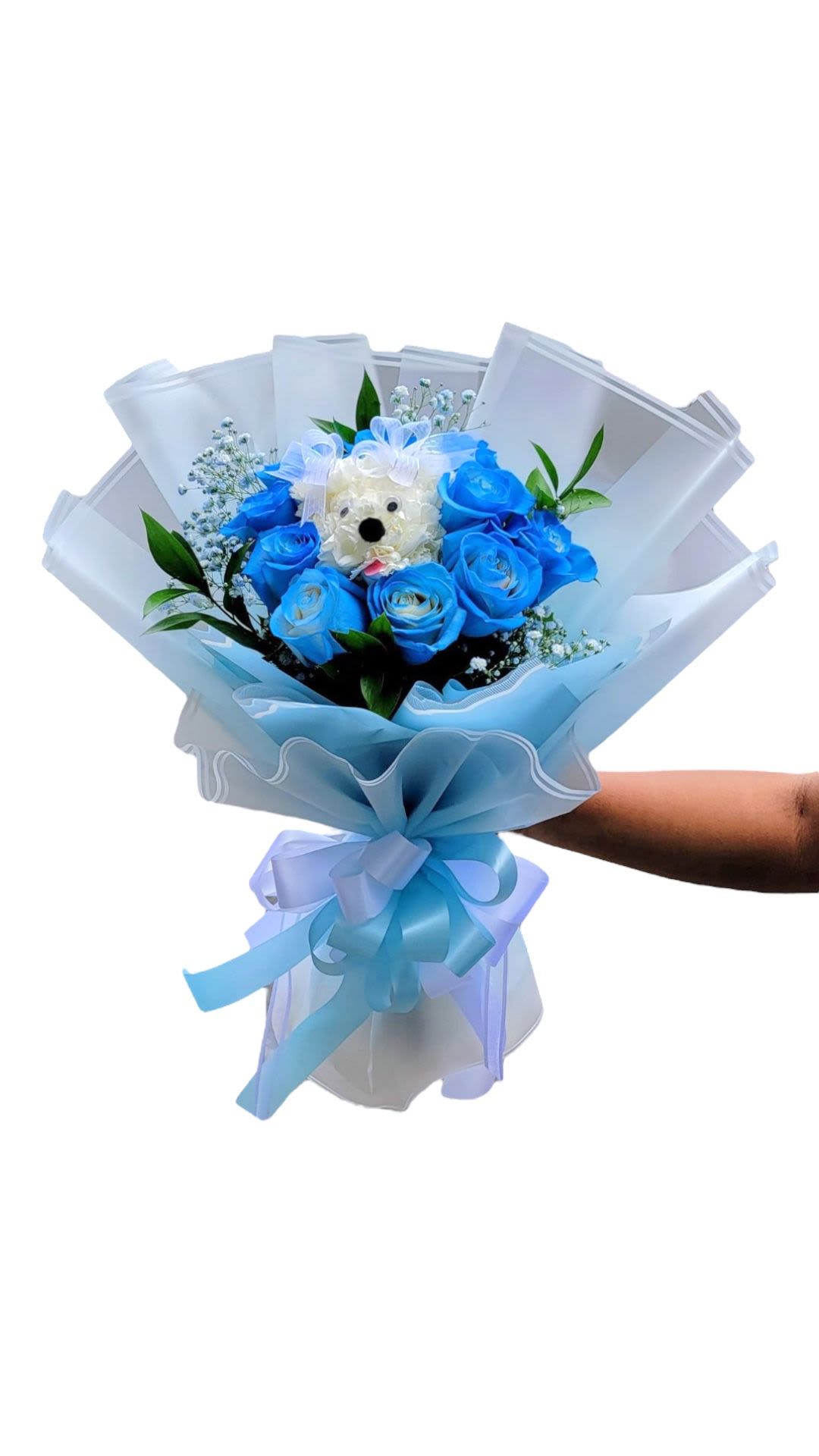 Blue rose bouquet with a small teddy bear center and ribbon wrap