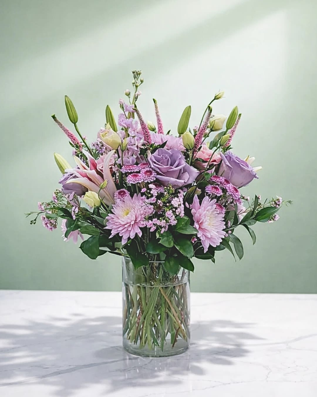 Lavender and pink bouquet in a clear glass vase