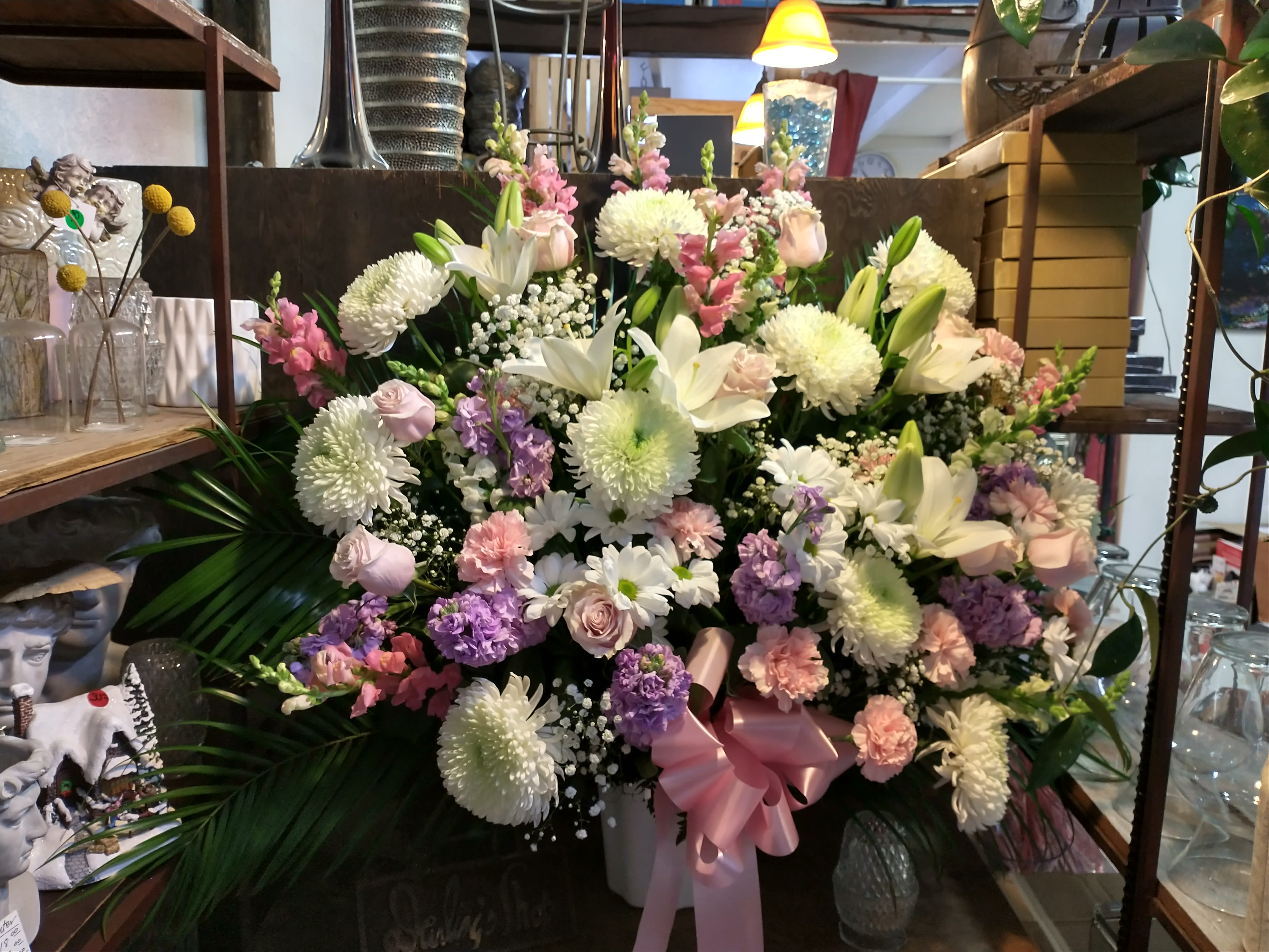 Large mixed bouquet with white lilies, chrysanthemums, and pink flowers