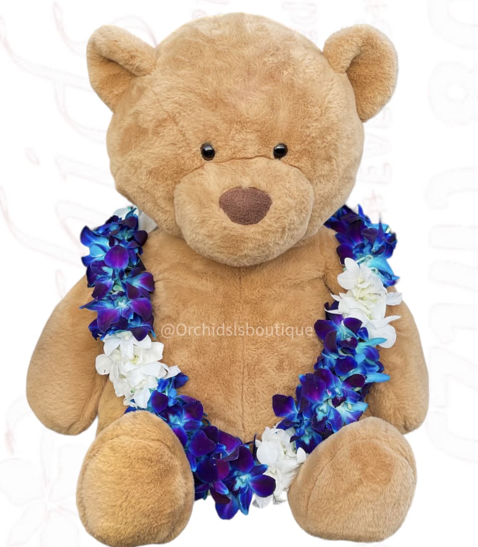 Plush teddy bear wearing a blue, purple, and white flower lei
