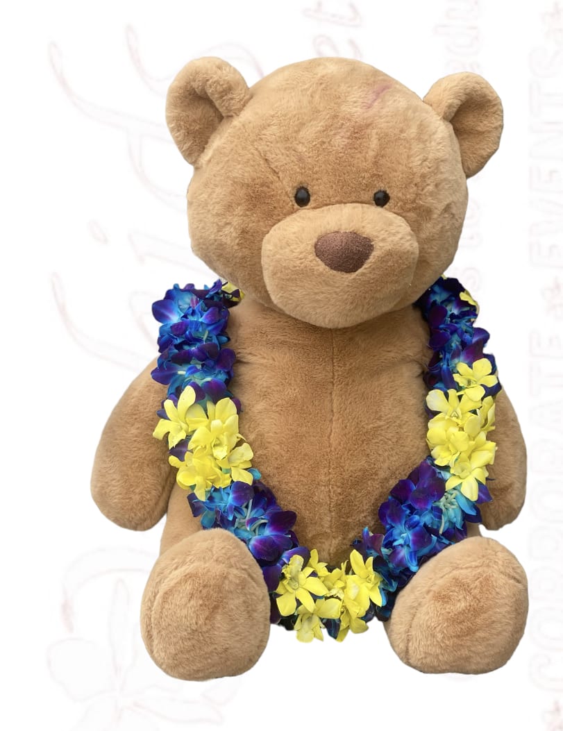 Plush teddy bear wearing a blue and yellow flower lei