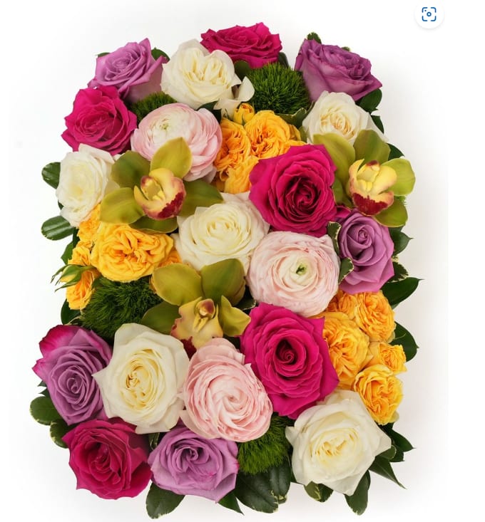 Round bouquet of multicolored roses with orchids and green accents