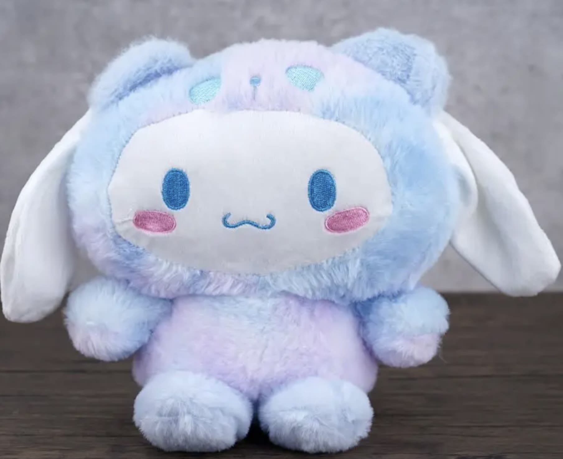 Pastel blue and lavender plush bunny with long white ears