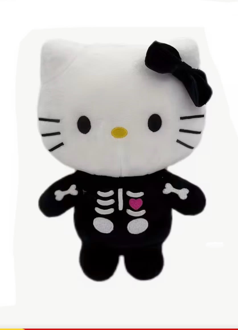 Hello Kitty plush toy in a black skeleton costume