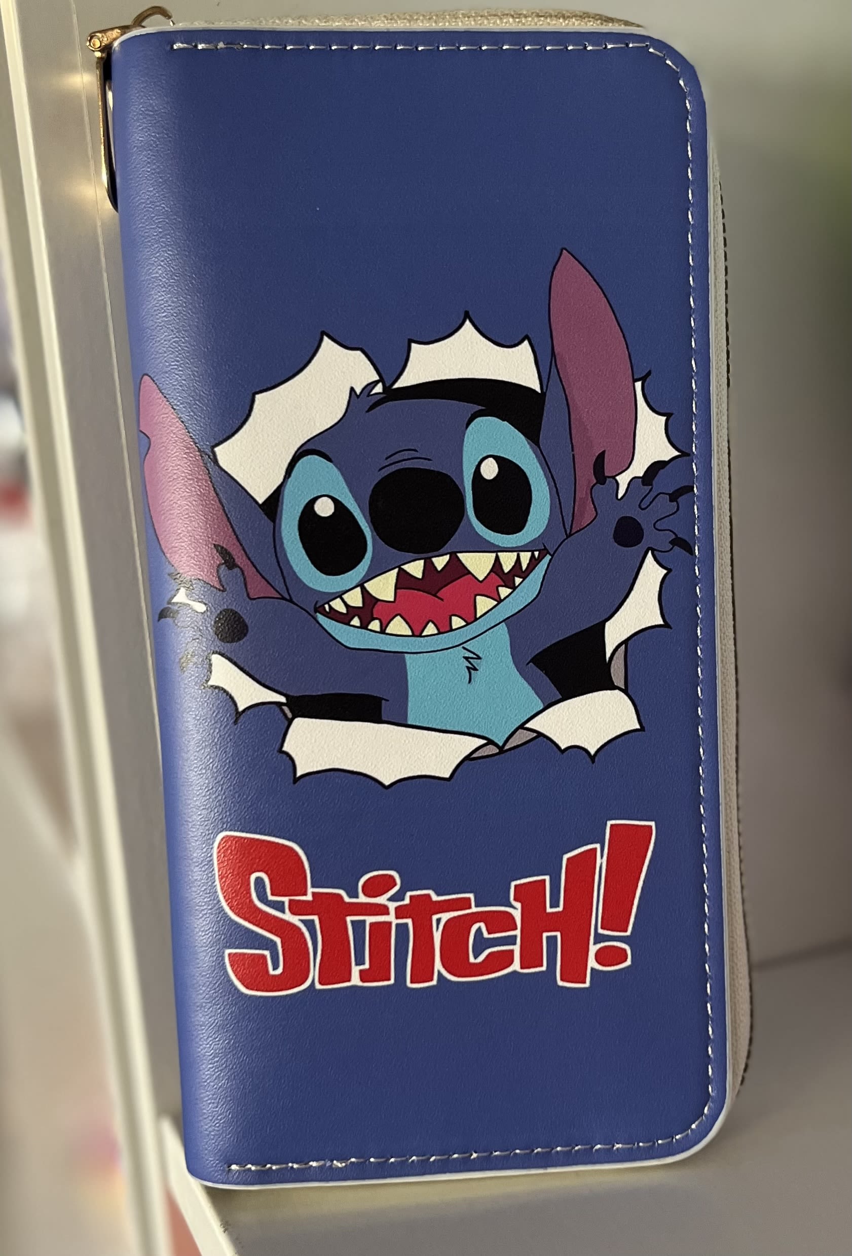 Blue Stitch wallet with a cartoon character graphic