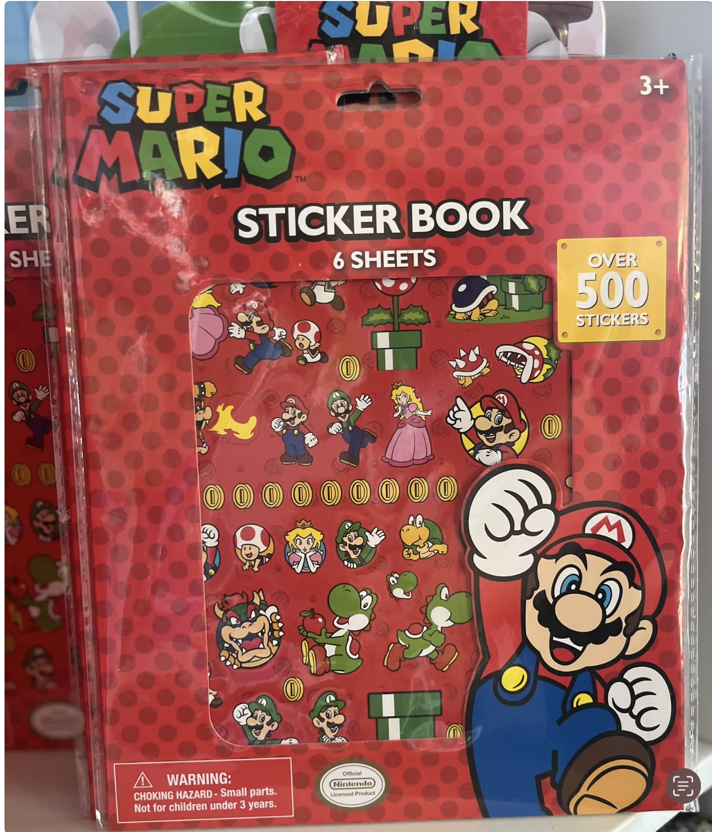 Super Mario sticker book in red packaging with cartoon characters