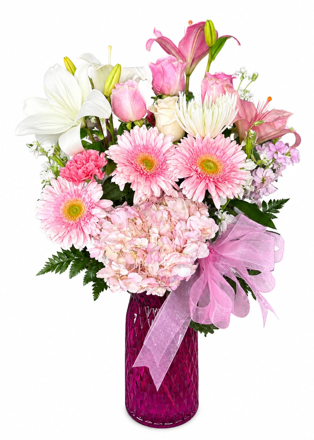 Pink and white mixed bouquet in a magenta vase with a pink ribbon