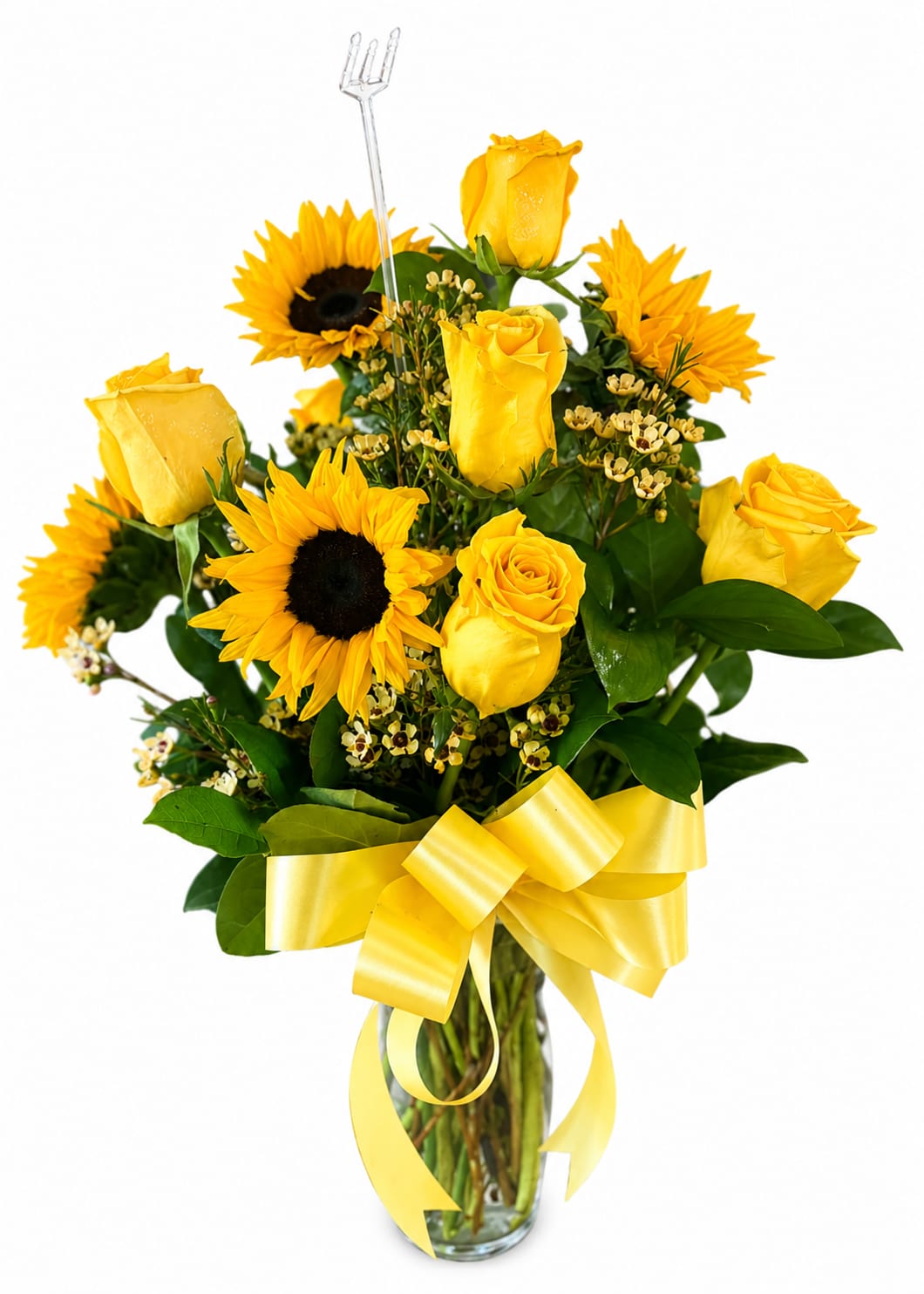 Yellow roses and sunflowers in a glass vase with a yellow ribbon