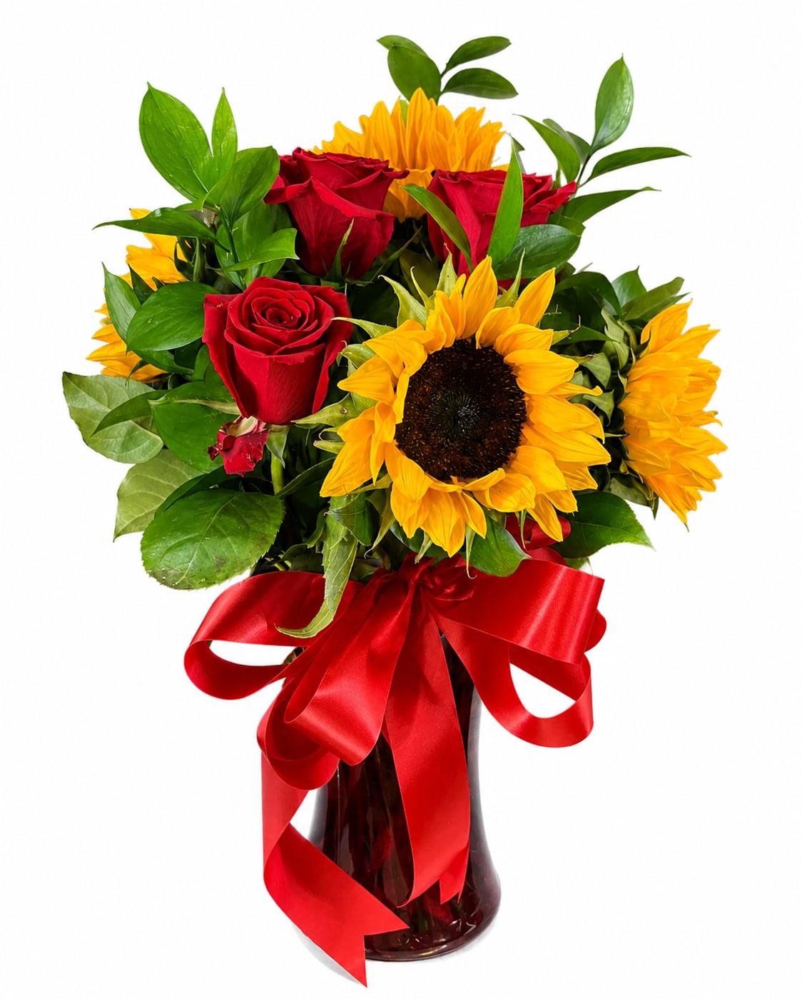 Bouquet of red roses and yellow sunflowers in a glass vase with a red ribbon